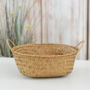 Detailed close-up of the diagonal weave pattern on a natural seagrass storage basket