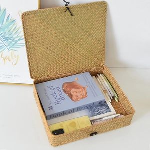 Handwoven seagrass storage box with lid showing large capacity for books and stationery