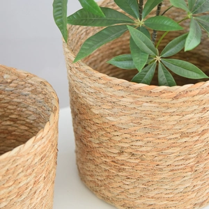 Detailed view of hand-woven natural fiber flower basket with spiral weaving texture