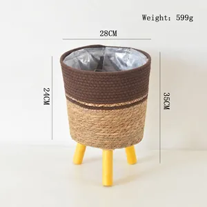 Detail of woven flower basket with dimensions 28x35cm and three wooden legs