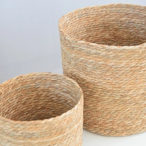 Detailed close-up of woven seagrass basket set showing natural textures and craftsmanship