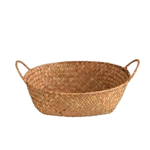 Natural seagrass storage basket with double handles and woven oval design for home snacks