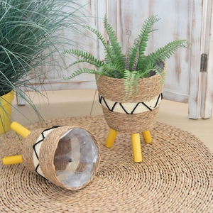 Detail showing handwoven texture and waterproof plastic liner of the nordic plant stand