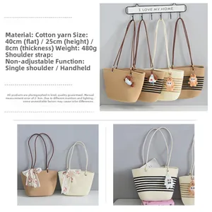 Detailed view of woven cotton tote bag dimensions 40x25x8cm showing shoulder strap design