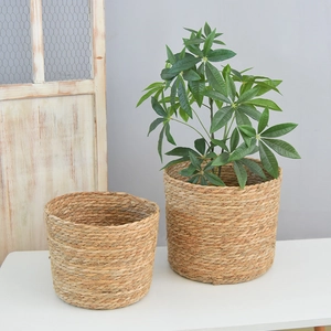 Set of two round handwoven seagrass flower baskets for indoor plants and home storage