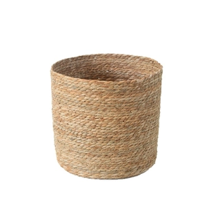 Handwoven cylindrical straw basket planter with natural plant fiber texture for floral decor