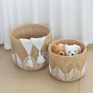 Bohemian woven storage baskets featuring white tassels and decorative textured patterns
