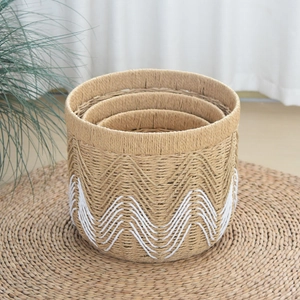 Three-piece set of woven storage baskets with white wave patterns for home organization