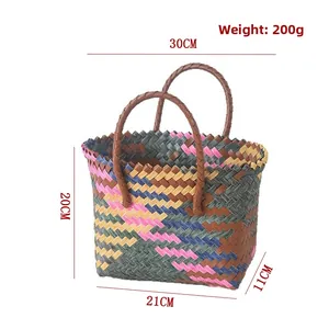 Macro detail of hand-woven colorful tote bag showing 20cm height and 30cm top width