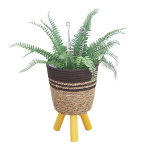 Nordic standing plant stand with artificial fern in a two-tone woven basket and yellow legs