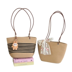 Straw woven tote bag with cute rabbit pendant and floral lace bow for summer beach travel