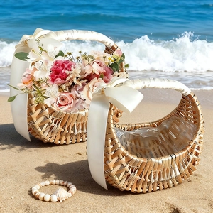Detail of hand-woven wicker flower baskets with white satin bows on a beach background