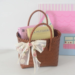 Handmade brown woven basket tote with floral white lace bow for commute and picnic