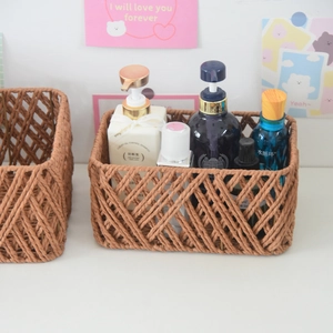 Macro view of woven storage basket featuring a detailed brown diamond grid weave pattern