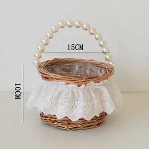 Detail showing woven wicker basket with pearl handle, lace decor and product dimensions