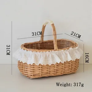 Close-up of hand-woven wicker picnic basket with white lace trim and single handle details