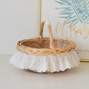 Handmade wicker picnic basket with elegant lace trim for photo props and home storage