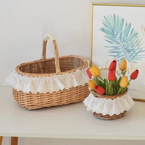 Detail of woven wicker baskets with white lace trim for picnics and home storage