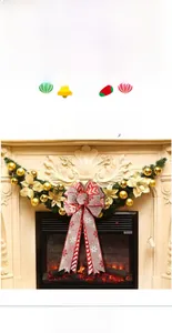 Detail of burlap Christmas bow with white snowflake prints and red striped ribbon edges