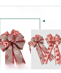 Detail of burlap Christmas bows with snowflake and maple leaf patterns for tree decor