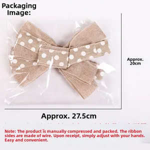 Close-up of burlap Christmas bow with white polka dots and flexible wire edges for tree decor