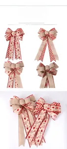 Close-up of burlap Christmas bows with red snowflake and reindeer patterns for tree decor