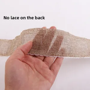 Detail of burlap ribbon with white lace edge showing natural fiber texture and single side trim