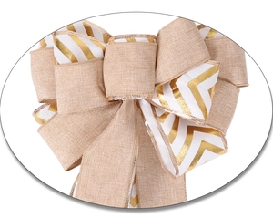 Close-up of double-layered Christmas bow made of burlap and gold striped ribbon for trees