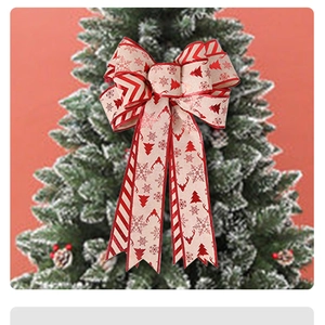 Detail of large double-layer burlap Christmas bow with festive reindeer and tree patterns