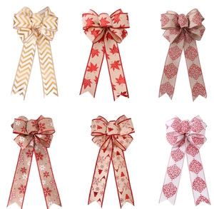 Detail view of six linen-textured Christmas bows with various festive holiday patterns