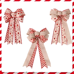 Three-piece set of large rustic Christmas tree topper bows with reindeer and snowflake patterns
