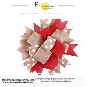 Detail view of handmade burlap Christmas bow with red polka dots and wire fastener