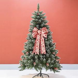 Large Christmas linen bow decoration with festive reindeer and snowflake patterns on a tree