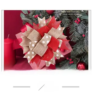 Close-up of rustic burlap Christmas bow with red accents on festive gift packaging