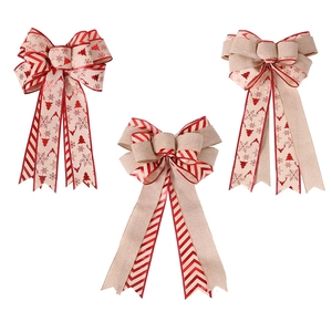 Three-piece large layered Christmas tree topper bows with festive reindeer and snowflake prints