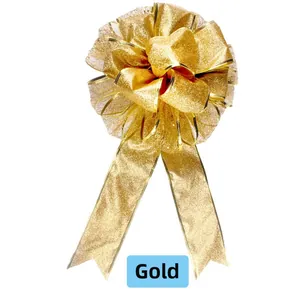 Detailed view of a large gold glitter Christmas bow decoration for festive party setups