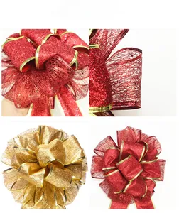 Detail of multi-layered red and gold Christmas bows with glitter mesh and gold edges