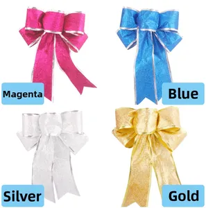 Detailed view of four glitter Christmas bows in rose red, blue, silver and gold
