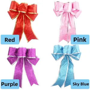 Close-up of sparkling sequined 25cm Christmas bows in red, pink, purple, and sky blue colors