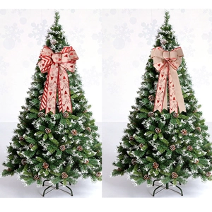 Double-layered large Christmas tree topper bows with festive patterns and long streamers