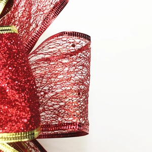 Red Christmas bow with gold trim and glitter mesh for festive party decoration