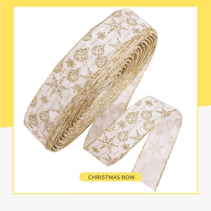 Detail of cream Christmas ribbon featuring gold glitter snowflakes and bells print