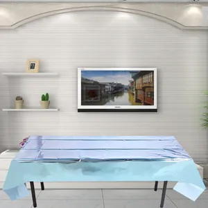 Close-up of light blue disposable PET tablecloth with metallic reflective texture for parties
