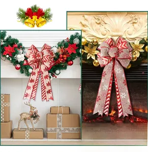 Detail of Christmas bows with red maple leaves and snowflake patterns on rustic burlap fabric
