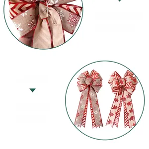 Close-up of Christmas bow decoration with red snowflake and striped maple leaf prints