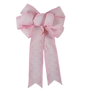 Close-up of pink layered bow ornament with white lace pattern and elegant V-cut ribbons
