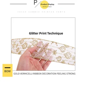 Close-up of white mesh Christmas ribbon with gold glitter snowflake prints and edges