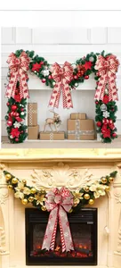 Detail showing red and white striped Christmas bows with snowflake patterns for tree decor