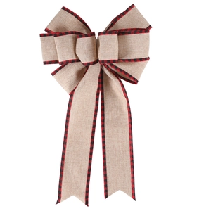 Detailed macro view of large burlap Christmas bow with red and black buffalo plaid edges