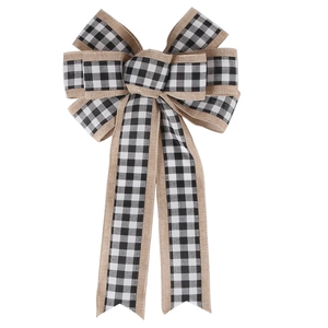 Detail of a large handmade linen bow with black and white plaid layers for Christmas trees